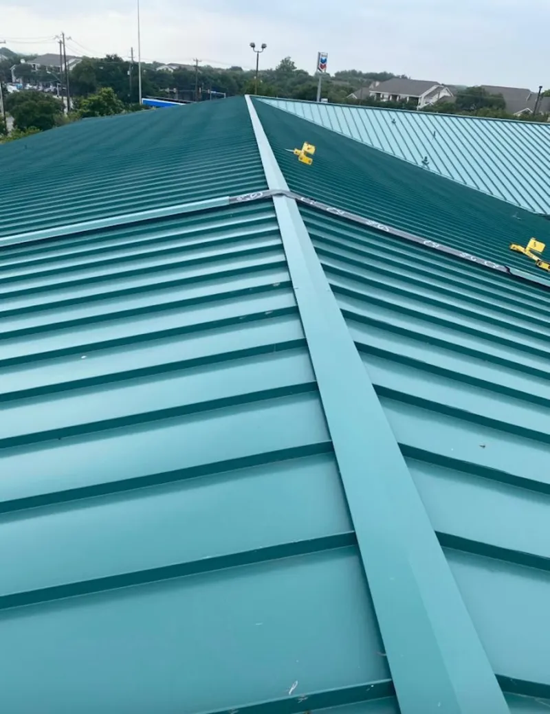 Green commercial metal roof ridge and valley for Metal Roof Repair in Maple Grove